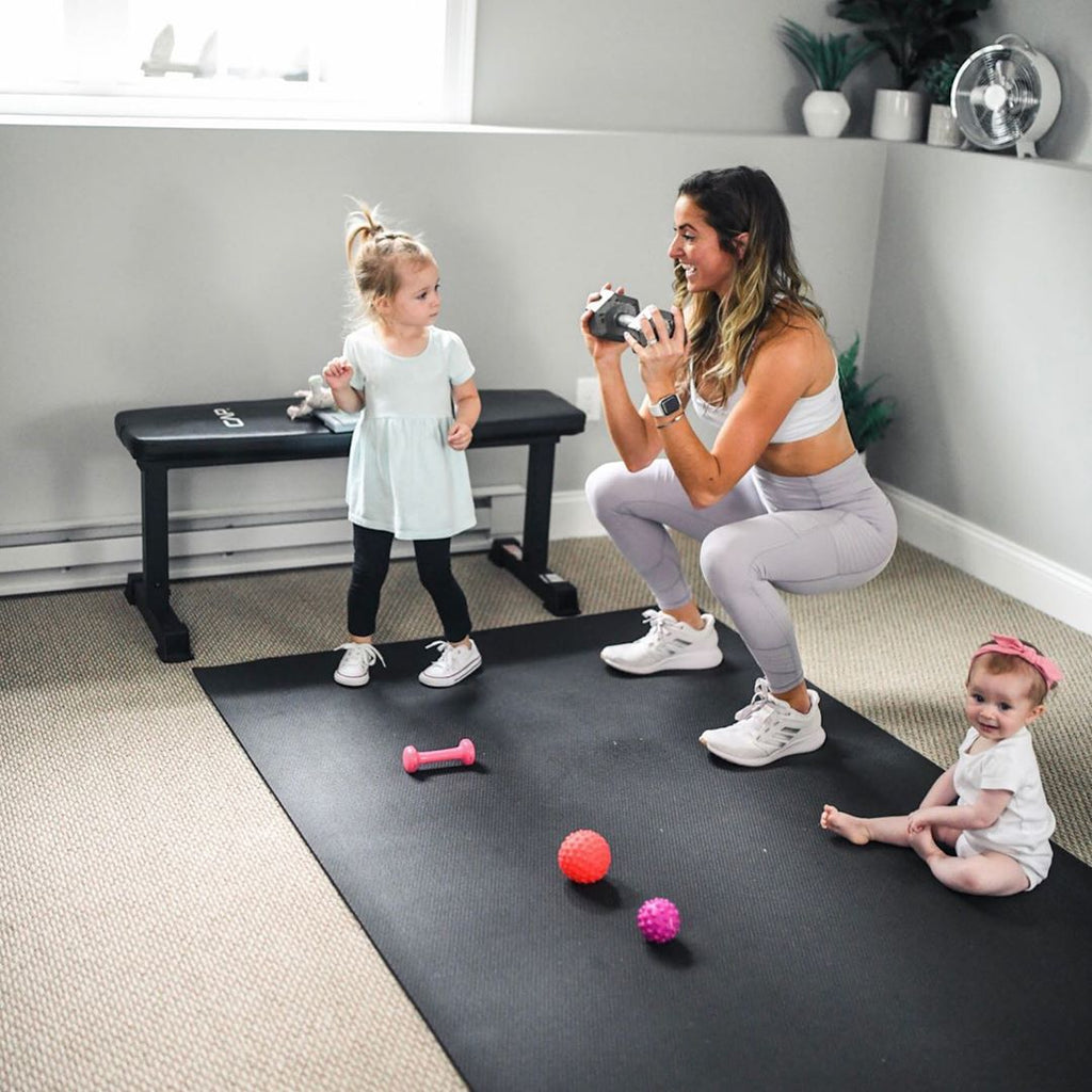 Family workout - mom with toddler and baby on Gorilla Mat